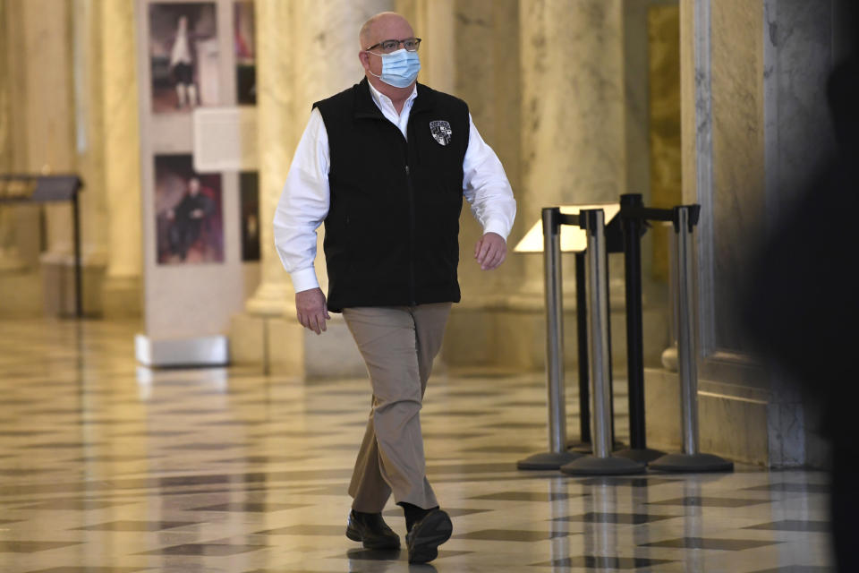 Maryland Gov. Larry Hogan arrives for a news conference in Annapolis, Md., Friday, April 10, 2020. Hogan provided several updates on the state's response to the coronavirus pandemic, including key budget actions and efforts to bolster the process to apply for unemployment. (AP Photo/Susan Walsh)