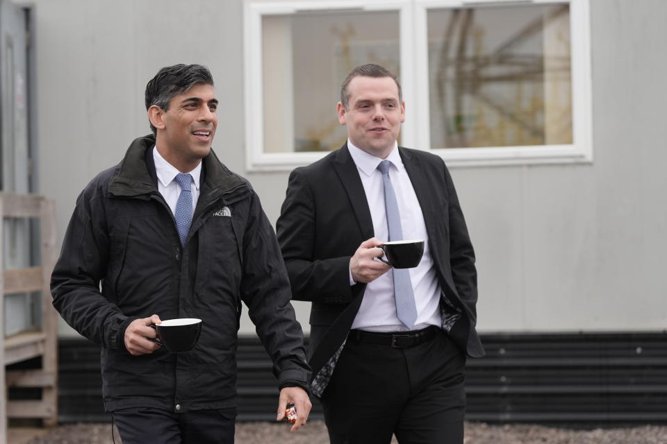 Rishi Sunak and Douglas Ross outside holding cups