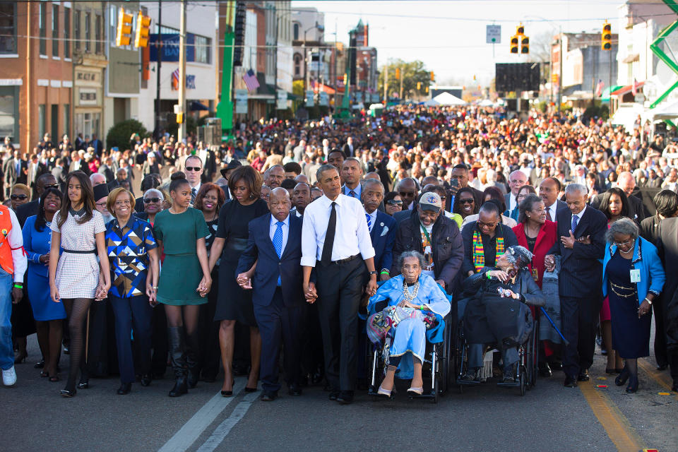 Barack Obama, Amelia Boynton, right, Rep. John Lewis and the President's family lead a march toward the Edmund Pettus Bridge in Selma, Ala., on March 7, 2015, 50 years after 