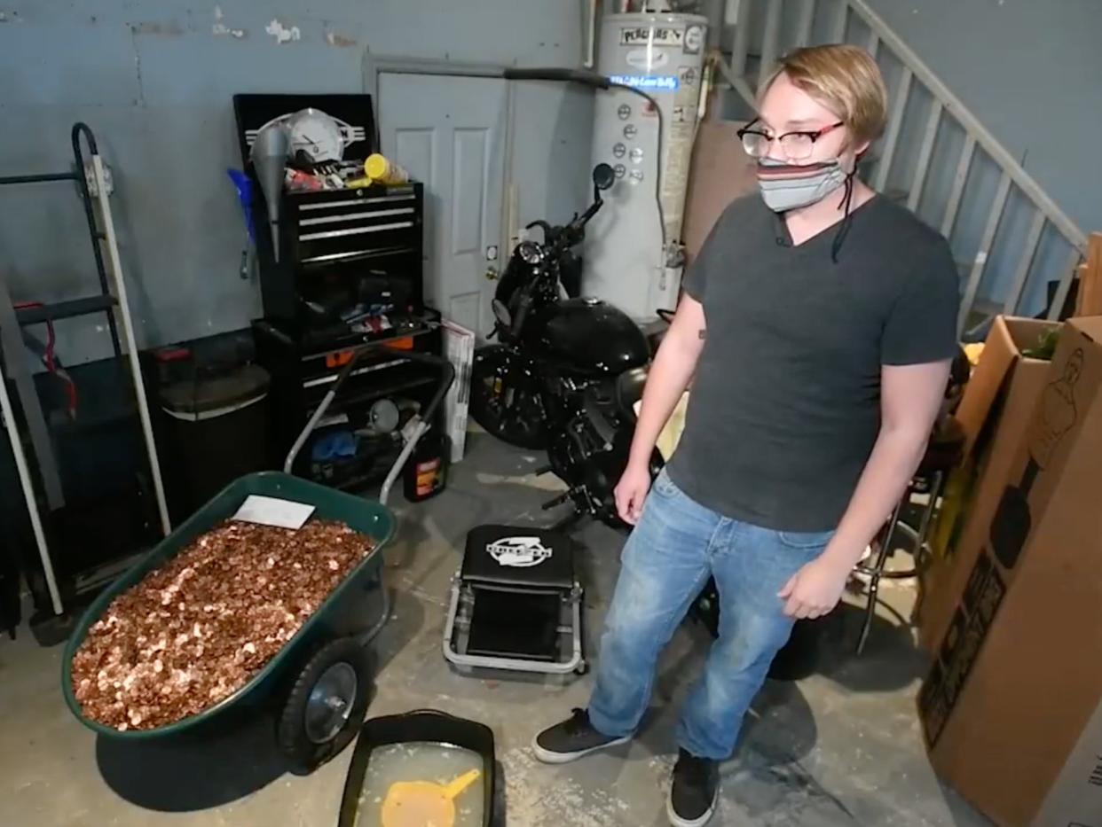 <p>Andreas Flaten posing with the 91,515 pennies in his Georgia home</p> ((Fox 5))