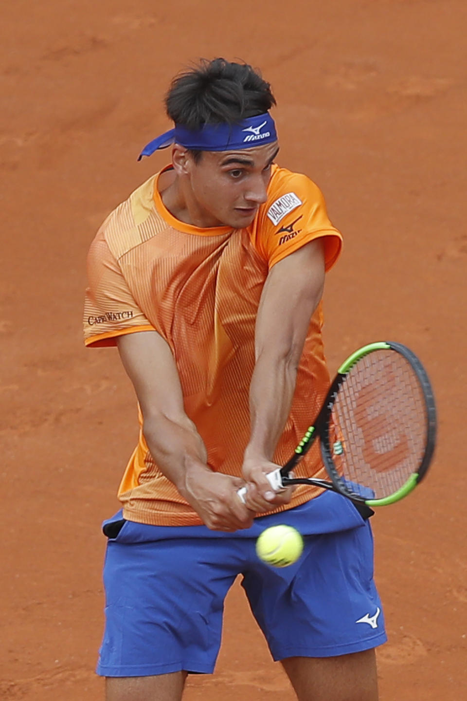 Italy's Lorenzo Sonego plays a shot against Switzerland's Roger Federer during their first round match of the French Open tennis tournament at the Roland Garros stadium in Paris, Sunday, May 26, 2019. (AP Photo/Michel Euler )