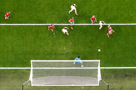 Soccer Football - World Cup - Group B - Morocco vs Iran - Saint Petersburg Stadium, Saint Petersburg, Russia - June 15, 2018 Morocco's Aziz Bouhaddouz scores an own goal for Iran's first goal REUTERS/Dylan Martinez