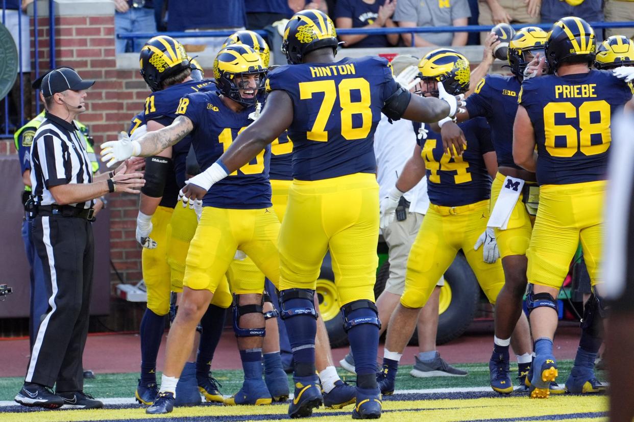 Michigan celebrates the touchdown by running back Donovan Edwards (7) during the 1st quarter against Fresno State at Michigan Stadium at Michigan Stadium in Ann Arbor on Saturday, Aug. 31, 2024.