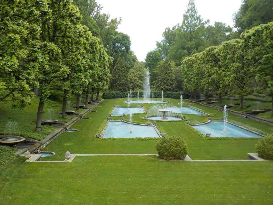 Lawns and water in a formal design at Longwood Gardens in Pennsylvania. Lawn is soothing to the eye and provides a simple green palette to show off the plants.