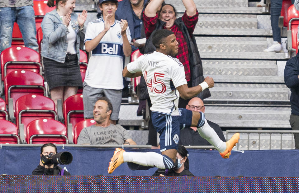 Vancouver Whitecaps' Pedro Vite celebrates after scoring a goal against the Houston Dynamo during the first half of an MLS soccer match Wednesday, May 31, 2023, in Vancouver, British Columbia. (Rich Lam/The Canadian Press via AP)