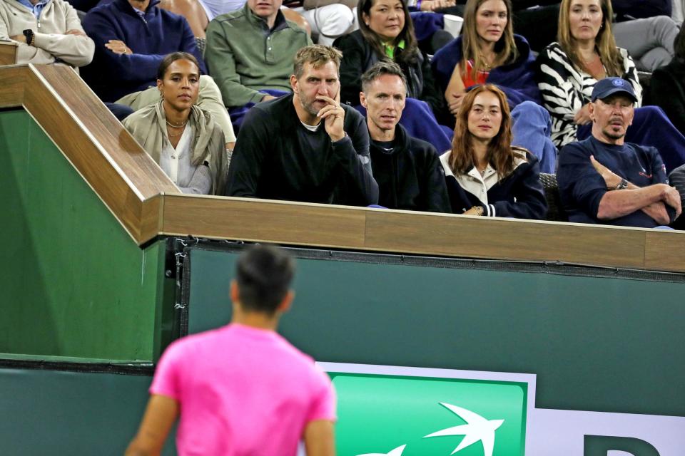 Former NBA players Dirk Nowitzki, second from left, and Steve Nash watch Carlos Alcaraz and Tallon Grieskpoor during the BNP Paribas Open in Indian Wells, Calif., on Monday, March 13, 2023. 