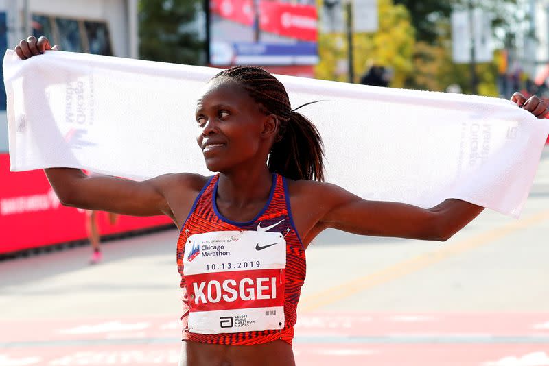 Chicago Marathon - Kenya's Brigid Kosgei reacts after winning the women's marathon setting a new world record