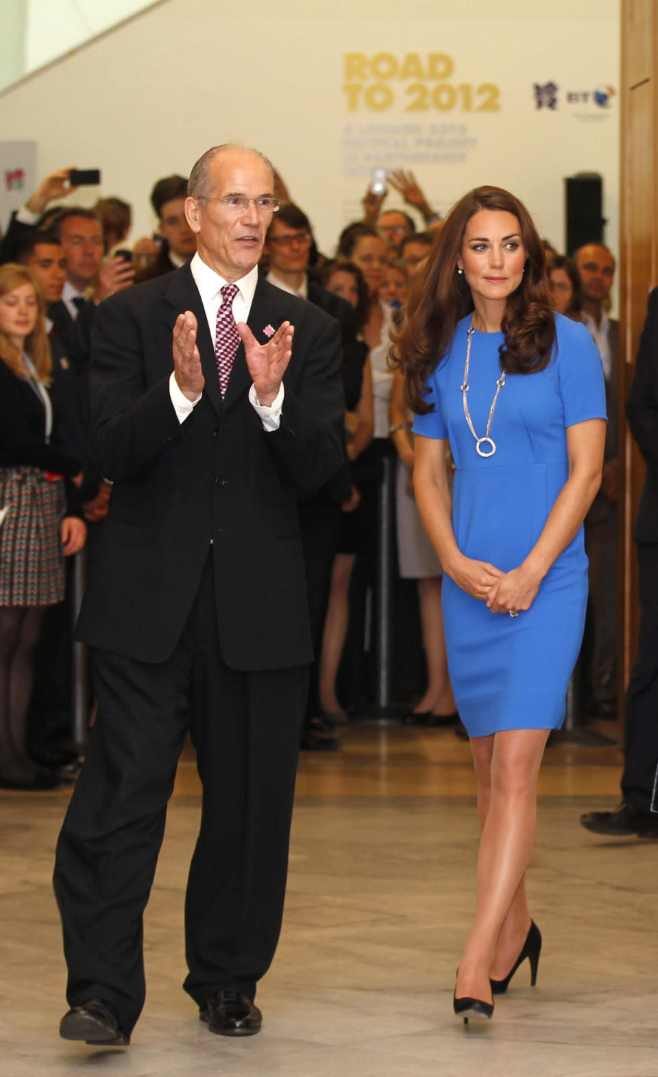 <p>Visiting an exhibition at the National Portrait Gallery, Kate donned a favourite blue Stella McCartney dress with a circular Cartier necklace. She completed the look with black Prada heels.</p><p><i>[Photo: PA]</i></p>