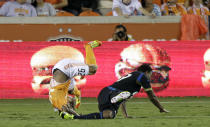 HOUSTON, TX - JUNE 30: Corey Ashe #26 of the Houston Dynamo is upended by Lionard Pajoy #23 of the Philadelphia Union in the second half at BBVA Compass Stadium on June 30, 2012 in Houston, Texas. (Photo by Bob Levey/Getty Images