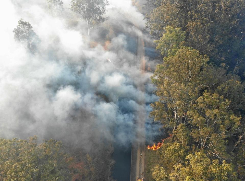 A bushfire pictured burning in the far Northern Region near Northey Road, Tolga.