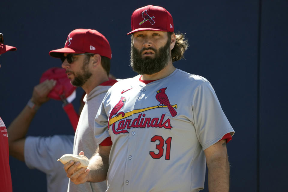 St. Louis Cardinals pitcher Lance Lynn holds a rosin bag during a spring training baseball workout Wednesday, Feb. 21, 2024, in Jupiter, Fla. (AP Photo/Jeff Roberson)