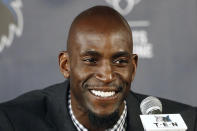 FILE - In this Feb. 24, 2015, file photo, Minnesota Timberwolves star Kevin Garnett speaks during an NBA basketball news conference in Minneapolis. Kobe Bryant, Tim Duncan and Kevin Garnett. Each was an NBA champion, an MVP, an Olympic gold medalist, annual locks for All-Star and All-Defensive teams. And now, the ultimate honor comes their way: On Saturday night, May 15, 2021, in Uncasville, Connecticut, they all officially become members of the Naismith Memorial Basketball Hall of Fame. (AP Photo/Jim Mone, File)
