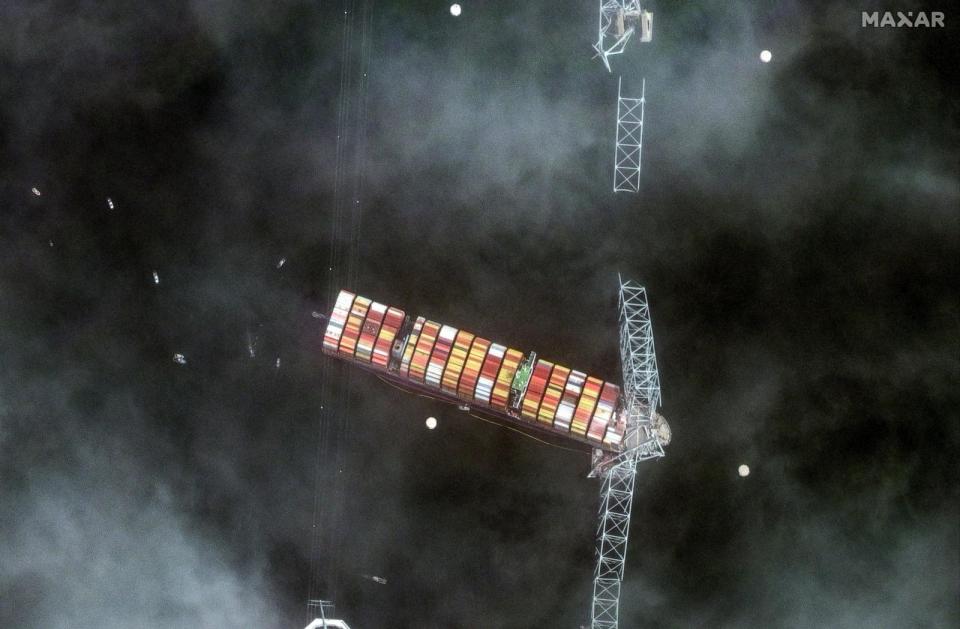 PHOTO: A satellite image shows a closer view of the Dali container ship and a collpased Francis Scott Key Bridge in Baltimore, Md., March 26, 2024.  (Maxar Technologies/via Reuters)