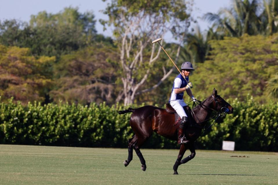 Prince Harry participates in the Royal Salute Polo Challenge to benefit Sentebale. REUTERS