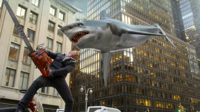 Associated PressIan Ziering, as Fin Shepard, battles a shark on a New York City street in a scene from “Sharknado 2: The Second One,” premiering Wednesday at 9 p.m.