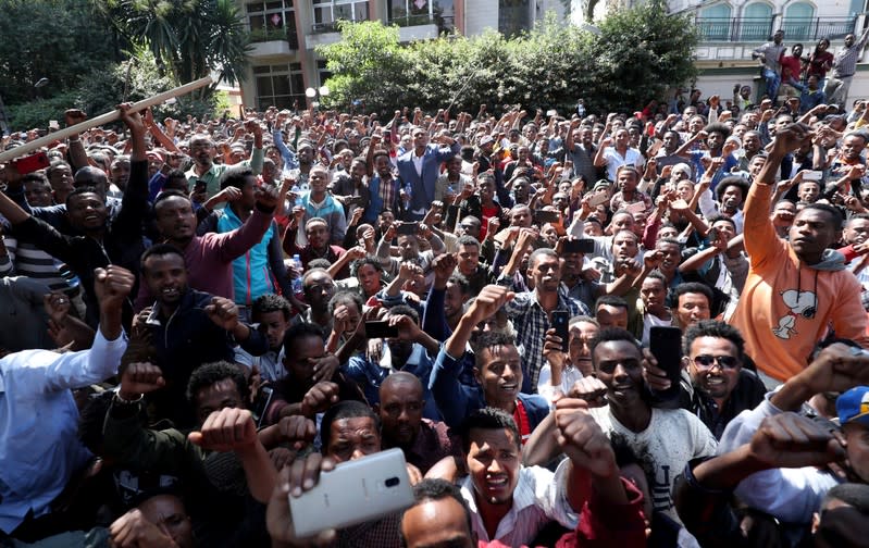 Oromo youth shout slogans outside Jawar Mohammed's house, an Oromo activist and leader of the Oromo protest in Addis Ababa