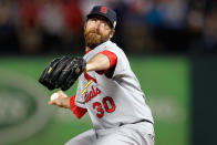 ARLINGTON, TX - OCTOBER 24: Jason Motte #30 of the St. Louis Cardinals pitches in the eighth inning during Game Five of the MLB World Series against the Texas Rangers at Rangers Ballpark in Arlington on October 24, 2011 in Arlington, Texas. The Rangers won 4-2. (Photo by Tom Pennington/Getty Images)