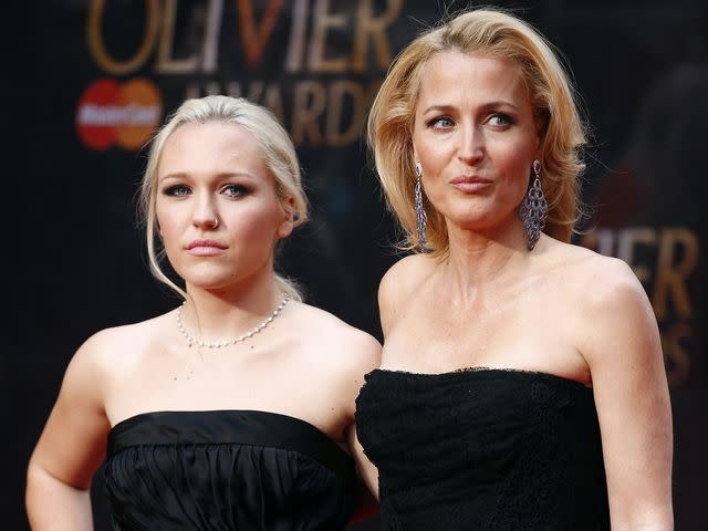 <p>JUSTIN TALLIS/AFP/Getty</p> Gillian Anderson and her daughter Piper Maru Klotz pose for photographers on the red carpet as they arrive for the Lawrence Olivier Awards in central London on April 12, 2015.