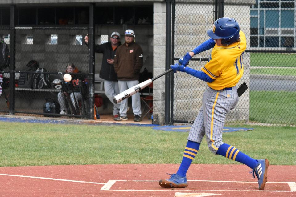 Ben Seitzinger lofts a ball into the air against Crawford County.