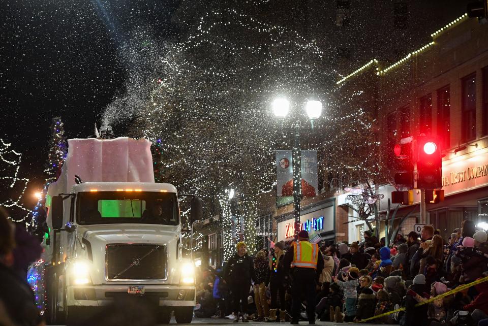 A truck releases fake snow into the air at the Parade of Lights on Friday, November 25, 2022, in downtown Sioux Falls.