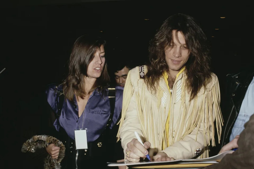 jon signing autographs for fans alongside his wife, dorothea, circa 1990