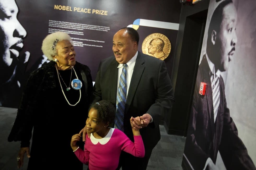 Martin Luther King III, right, the son of Rev. Martin Luther King Jr., walks with his daughter Yolanda, and Naomi King, left, the wife of Rev. King’s brother, A.D., through an exhibition devoted to the awarding of the Nobel Peace Prize to King at the Martin Luther King Jr. (AP Photo/David Goldman, File)