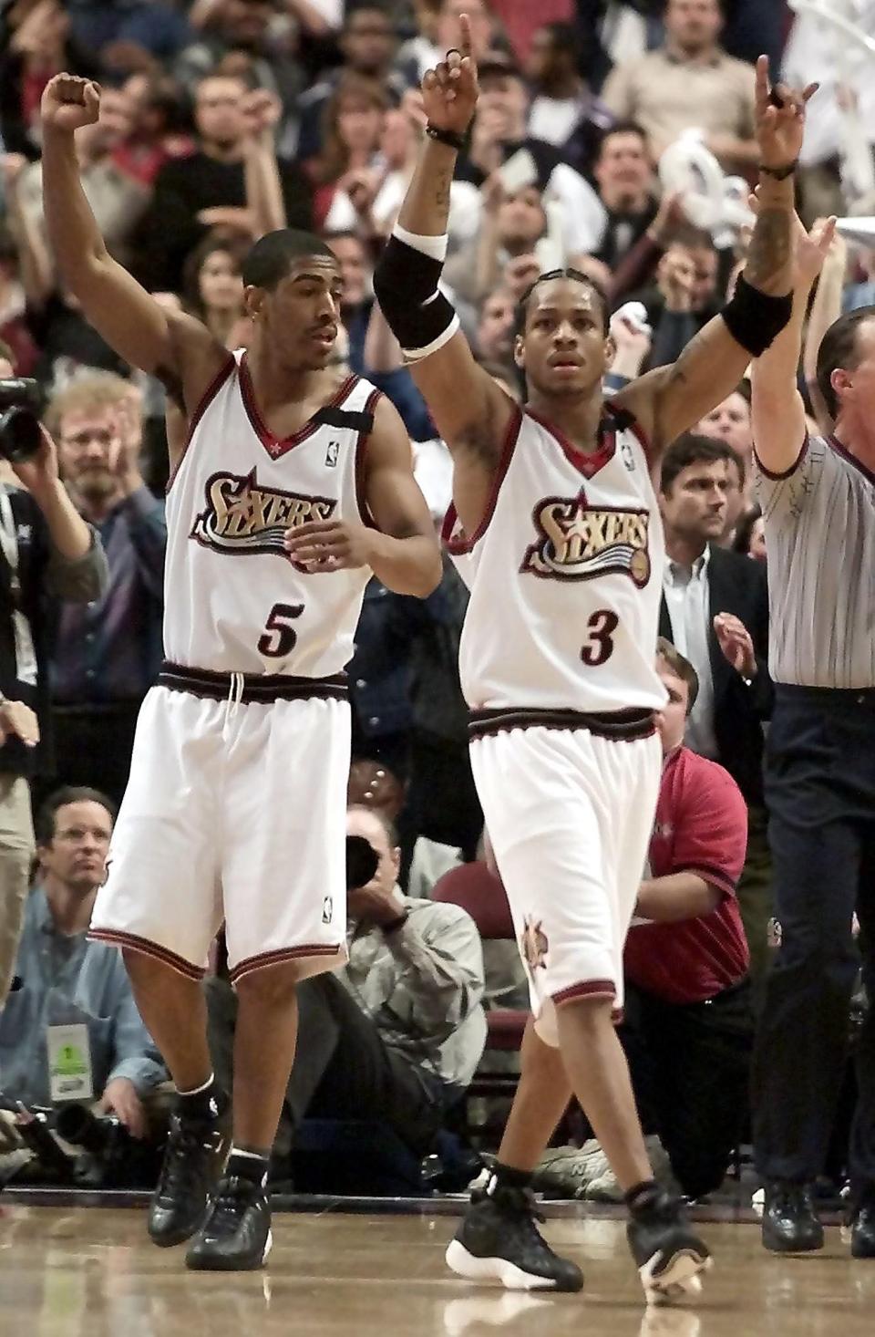 Philadelphia 76ers guards Kevin Ollie, left, and Allen Iverson celebrate the 81-76 victory over the Charlotte Hornets, as the final buzzer sounds in Game 3 of the NBA playoffs first-round series against the Charlotte Hornets, April 28, 2000 at First Union Center in Philadelphia.