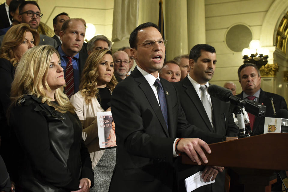 Attorney General Josh Shapiro of Pennsylvania speaks at a news conference in the state Capitol after legislation to respond to a landmark grand jury report accusing hundreds of Roman Catholic priests of sexually abusing children over decades stalled in the Legislature, Wednesday, Oct. 17, 2018 in Harrisburg, Pa. Shapiro is flanked by lawmakers and victims of child sexual abuse. (AP Photo/Marc Levy)