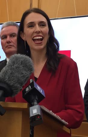 New Zealand Labour leader Jacinda Ardern smiles as she speaks to the press after leader of New Zealand First party Winston Peters announced his support for her party in Wellington, New Zealand, October 19, 2017. REUTERS/Charlotte Greenfield