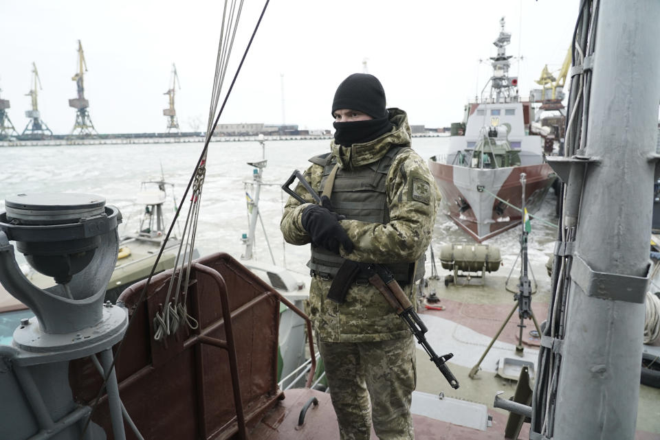 A Ukrainian serviceman stands on board a coast guard ship in the Sea of Azov port of Mariupol, eastern Ukraine, Monday, Dec. 3, 2018. The Ukrainian military has been on increased readiness as part of martial law introduced in the country in the wake of the Nov. 25, 2018 incident in the Sea of Azov, in which the Russian coast guard fired upon and seized three Ukrainian navy vessels along with their crews. (AP Photo/Evgeniy Maloletka)