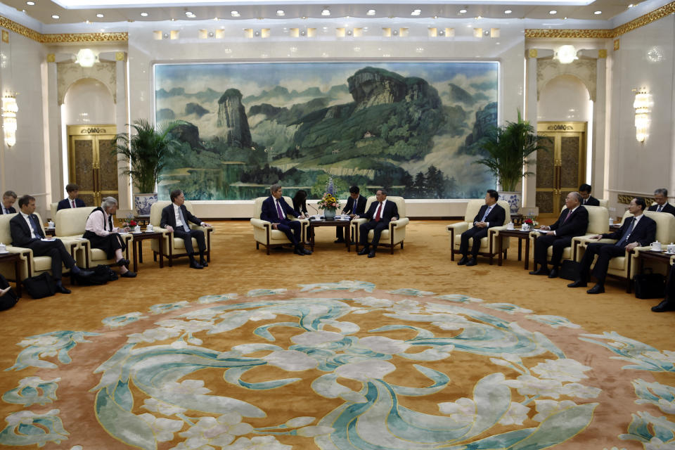 U.S. Special Presidential Envoy for Climate John Kerry, center left, attends a meeting with Chinese Premier Li Qiang, center right, at the Great Hall of the People in Beijing Tuesday, July 18, 2023. (Florence Lo/Pool Photo via AP)