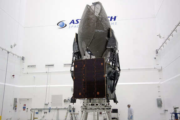 In the Astrotech payload processing facility in Titusville, Fla. near NASA’s Kennedy Space Center, a Boeing technician checks out the Tracking and Data Relay Satellite, TDRS-K. This image was released Jan. 11, 2013.