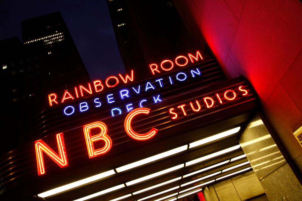 A marquis advertises the Rainbow Room, the Observation Deck, and NBC Studios in New York.