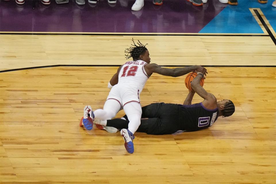 Alabama Crimson Tide guard Latrell Wrightsell Jr. (12) battles Grand Canyon Antelopes guard Jovan Blacksher Jr. (10) for the ball in the first half at Spokane Veterans Memorial Arena.