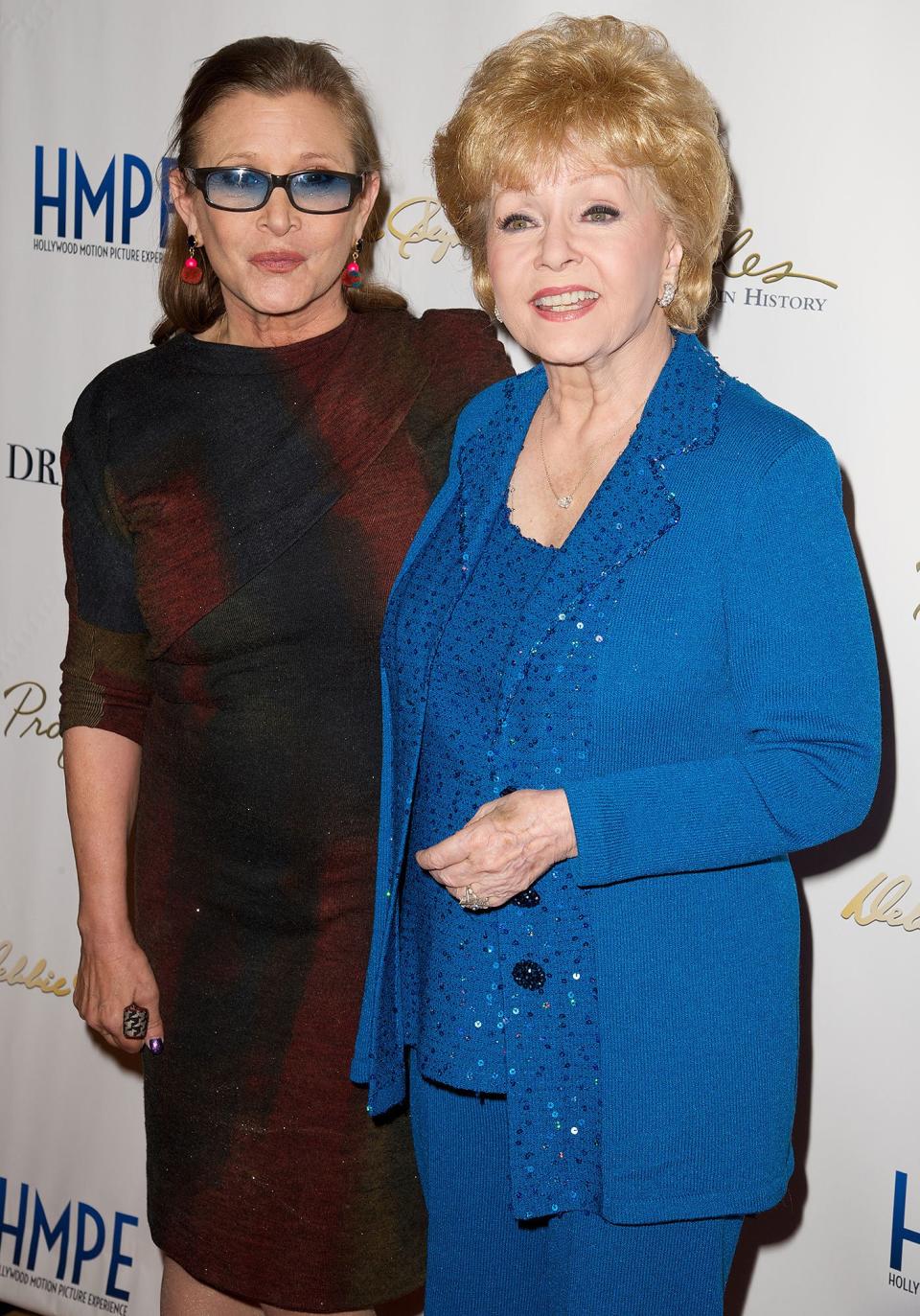 Fisher joins her mom for a preview of her auction in North Hollywood in 2014. 