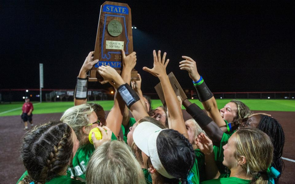 Brantley players celebrate with the championship trophy during the AHSAA class 1A state championship at University Field in Jacksonville, Ala., on Wednesday, May 17, 2023. Brantley defeated Leroy  6-2 to sweep the series 2-0. 