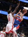 Washington Wizards' Deni Avdija (9) shoots as Houston Rockets' Jae'Sean Tate (8) defends during the first half of an NBA basketball game Wednesday, Jan. 5, 2022, in Washington. (AP Photo/Luis M. Alvarez)