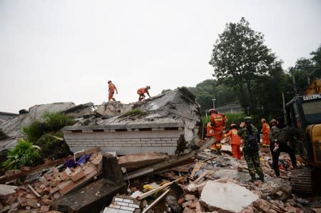 Rescue workers search for survivors in the rubble after earthquakes hit Changning county in Yibin