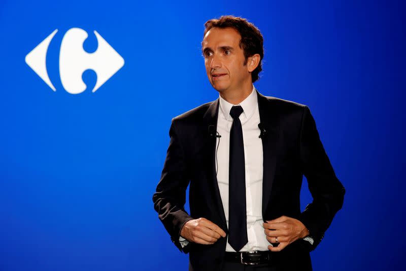 FILE PHOTO: Alexandre Bompard, CEO of French retailer Carrefour, poses before a news conference in La Defense near Paris