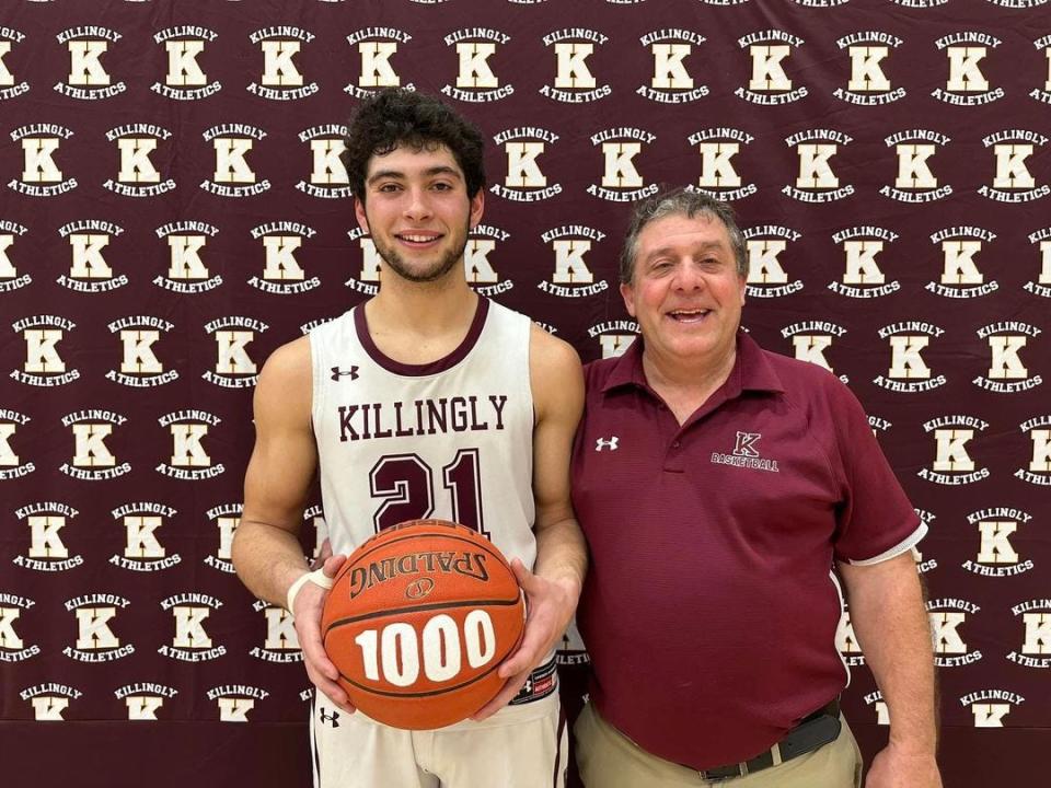 Killingly senior Yianni Baribeau and Killingly head coach Jim Crabtree celebrate after Baribeau scored his 1,000th career point Jan. 12. Baribeau became the only Killingly player to score 1,000 points and grab 1,000 rebounds during Thursday's ECC tournament win against Stonington.