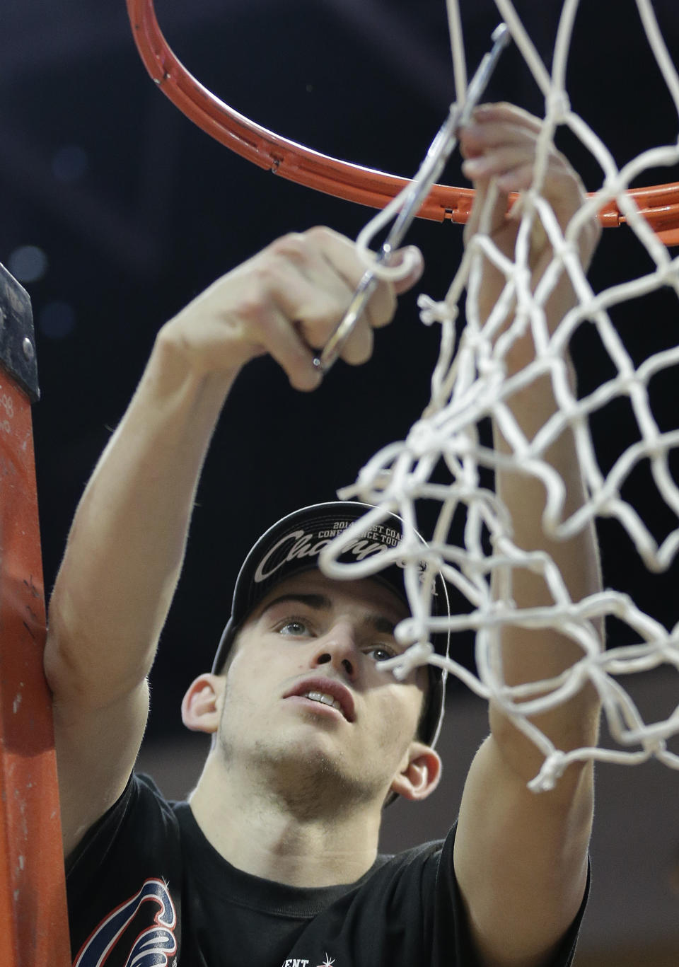 Gonzaga's David Stockton cuts down part the net after Gonzaga defeated BYU 75-64 in an NCAA college basketball game for the West Coast Conference men's tournament title, Tuesday, March 11, 2014, in Las Vegas. (AP Photo/Julie Jacobson)