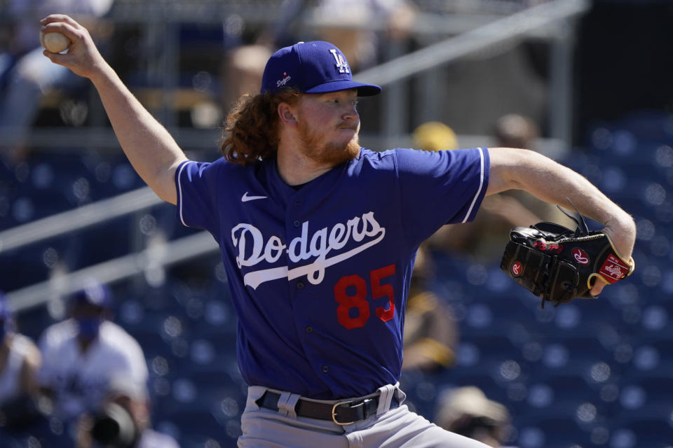 Los Angeles Dodgers' Dustin May pitches during the first inning of the team's spring training baseball game against the San Diego Padres, Saturday, March 20, 2021, in Peoria, Ariz. (AP Photo/Sue Ogrocki)