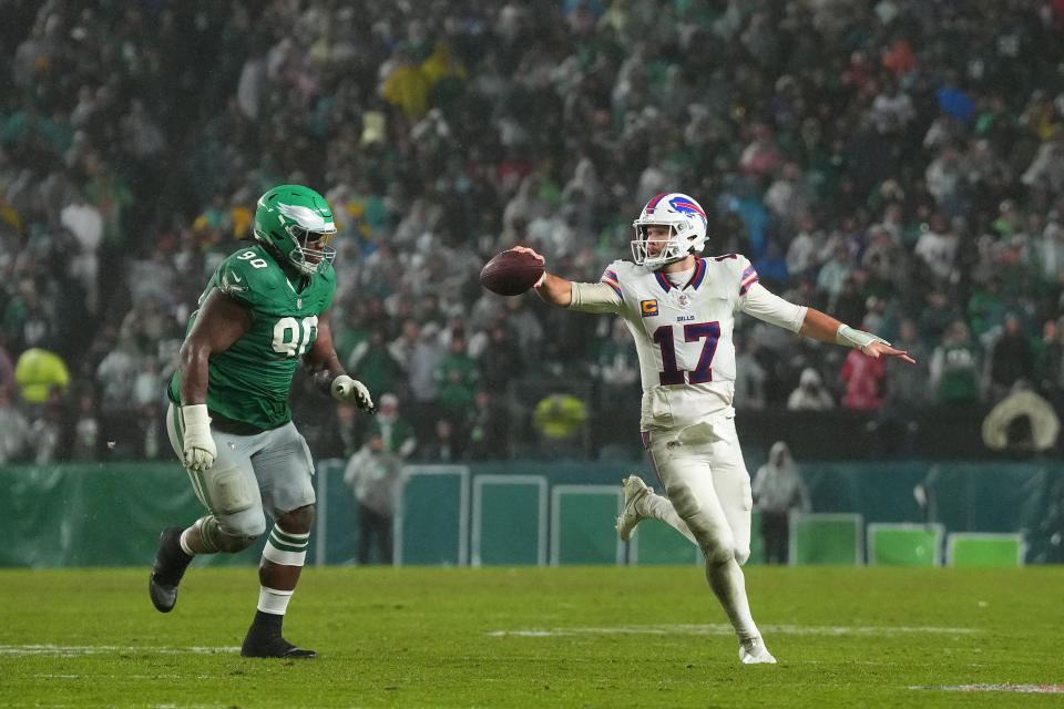 PHILADELPHIA, PENNSYLVANIA – NOVEMBER 26: Josh Allen #17 of the Buffalo Bills runs past Jordan Davis #90 of the <a class="link " href="https://sports.yahoo.com/nfl/teams/philadelphia/" data-i13n="sec:content-canvas;subsec:anchor_text;elm:context_link" data-ylk="slk:Philadelphia Eagles;sec:content-canvas;subsec:anchor_text;elm:context_link;itc:0">Philadelphia Eagles</a> during overtime at Lincoln Financial Field on November 26, 2023 in Philadelphia, Pennsylvania. (Photo by Mitchell Leff/Getty Images)