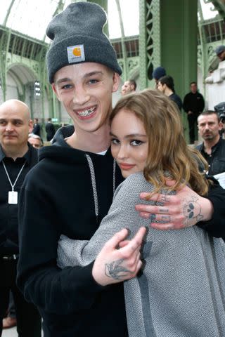 <p>Bertrand Rindoff Petroff/Getty</p> Lily-Rose Depp and Ash Stymest attend the Chanel show as part of the Paris Fashion Week