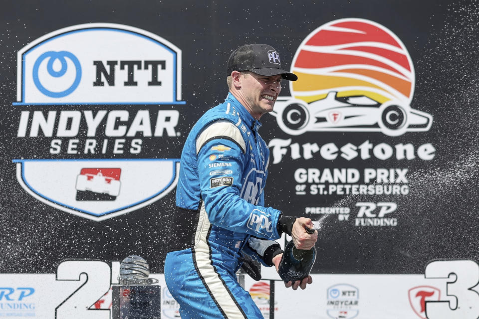 Team Penske driver Josef Newgarden, of the United States, celebrates his victory in the IndyCar Grand Prix of St. Petersburg auto race, Sunday, March 10, 2024, in St. Petersburg, Fla. (AP Photo/Mike Carlson)