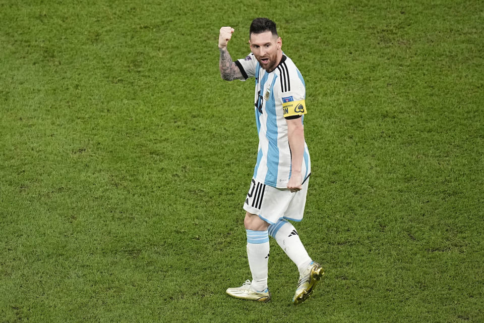 Argentina's Lionel Messi celebrates after scoring during the World Cup quarterfinal soccer match between the Netherlands and Argentina, at the Lusail Stadium in Lusail, Qatar, Friday, Dec. 9, 2022. (AP Photo/Ariel Schalit)