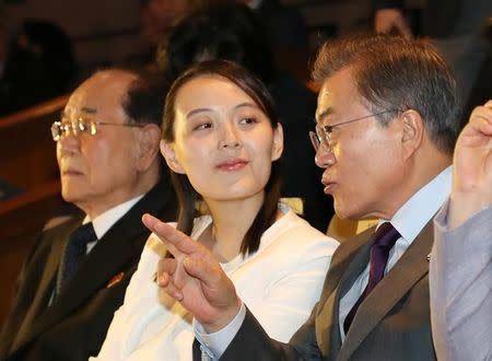 South Korean President Moon Jae-in talks with Kim Yo Jong, the sister of North Korea's leader Kim Jong Un, while watching North Korea's Samjiyon Orchestra's performance in Seoul, South Korea, February 11, 2018. Yonhap via REUTERS