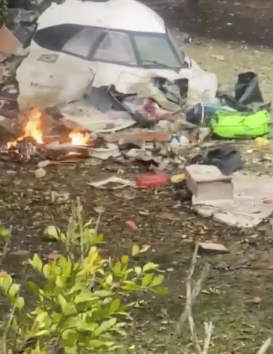 This frame grab from video shows wreckage from a plane that crashed by a home in Vinhedo, Sao Paulo state, Brazil, Friday, Aug. 9, 2024. (Felipe Magalhaes Filho via AP)