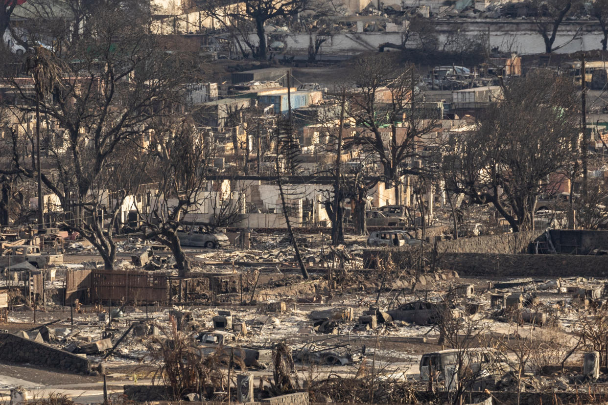 Charred remains of a burned neighbourhood is seen in the aftermath of a wildfire, in Lahaina, western Maui, Hawaii on August 14, 2023. The death toll in Hawaii's wildfires rose to 99 and could double over the next 10 days, the state's governor said August 14, as emergency personnel painstakingly scoured the incinerated landscape for more human remains.
Last week's inferno on the island of Maui is already the deadliest US wildfire in a century, with only a quarter of the ruins of the devastated town of Lahaina searched for victims so far. (Photo by Yuki IWAMURA / AFP) (Photo by YUKI IWAMURA/AFP via Getty Images)