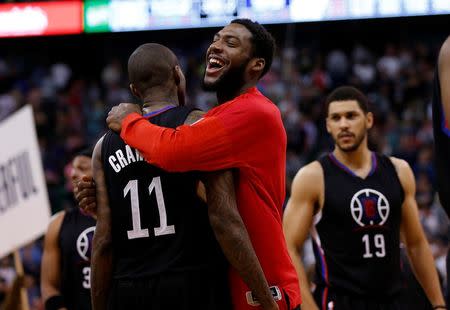 Apr 8, 2016; Salt Lake City, UT, USA; Los Angeles Clippers guard Jamal Crawford (11) celebrates with teammate after hitting the game winning shot in overtime against the Utah Jazz at Vivint Smart Home Arena. The Los Angeles Clippers defeated the Utah Jazz 102-99 in overtime. Mandatory Credit: Jeff Swinger-USA TODAY Sports